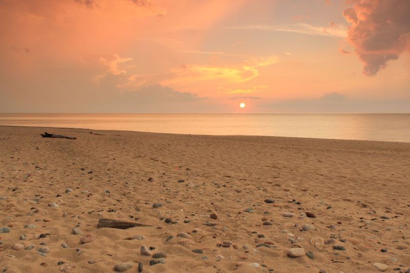 sunset in between the rain at woodland park grand marais