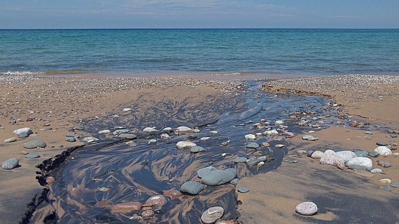 rocks and stream at grand sable dunes