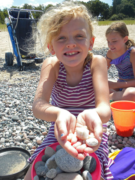 collecting rocks on the beach in grand marais michigan