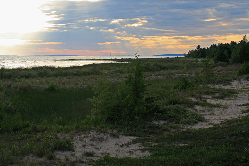 the sunrise over the mac bridge from waugoshance point