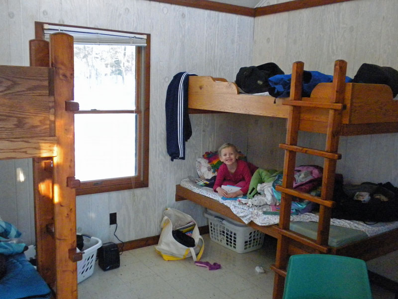 inside of the pines mini camper cabin at ludington state park