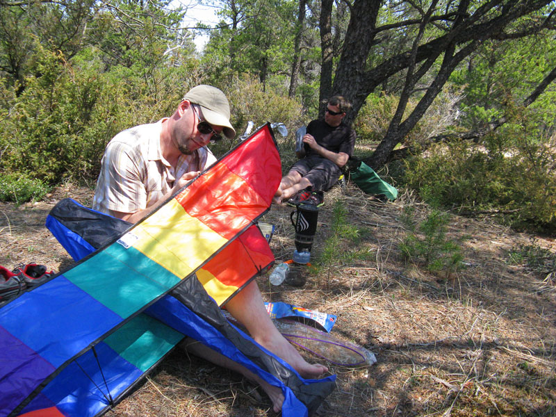 eating lunch in the shade at nordhouse dunes backpacking