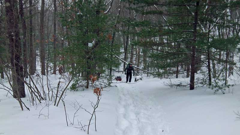 pulling the sled back up from the campsite at lost lake