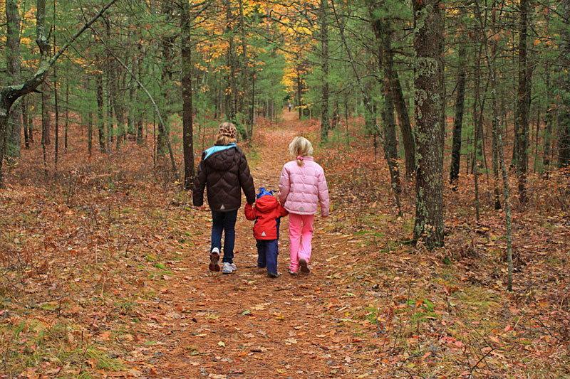 the kids walking back on the railroad grade trail