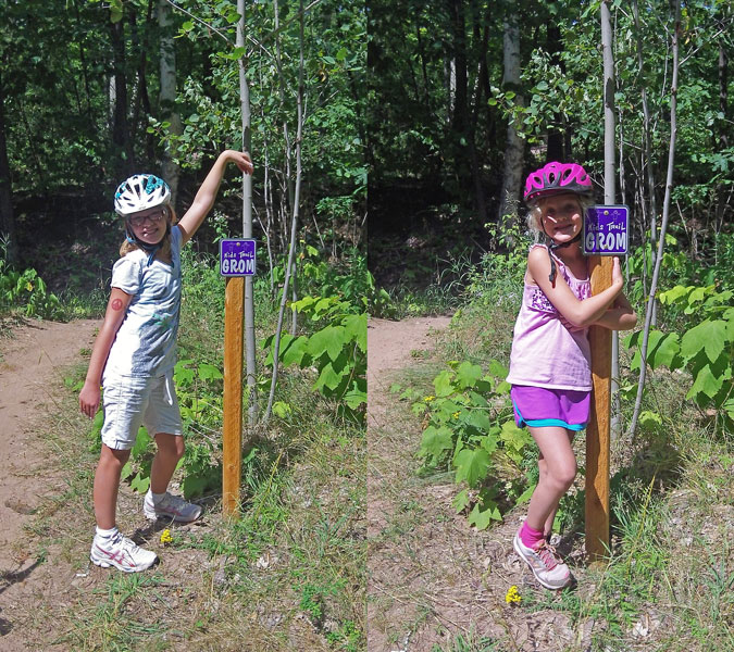 posing by the purple grom trail marker