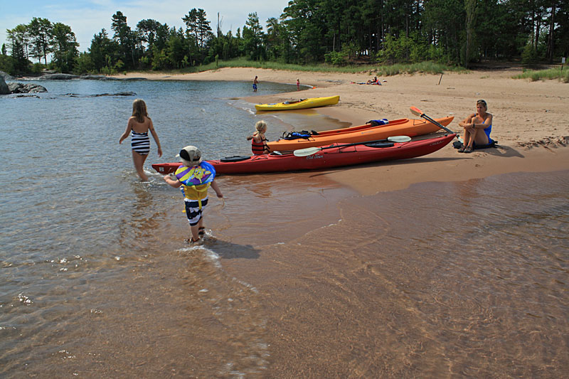 the beach by the marquette lighthouse