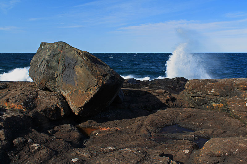 waves crashing into the rocks at presque isle park marquette mi