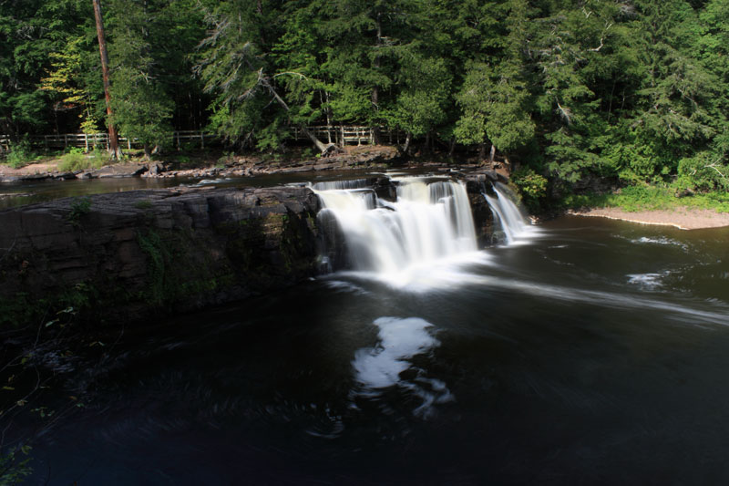 manabezho falls from the east river trail on the presquie isle river