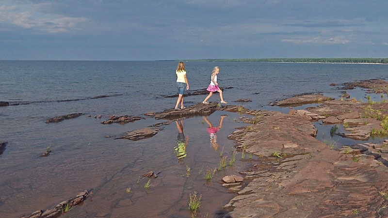 the girls walking along union bay