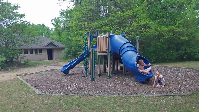 the playground and bathhouse at warren dunes campground