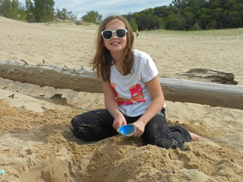 playing in the sand at warren dunes state park