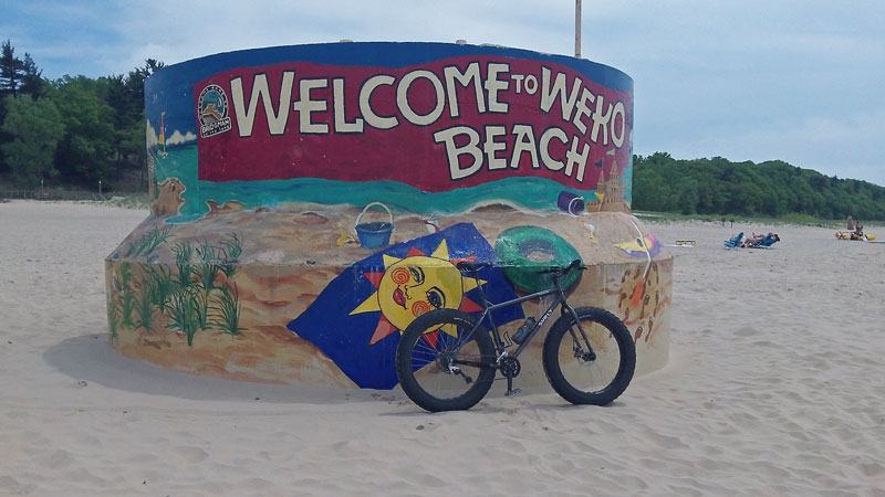 fat bike at weko beach sign