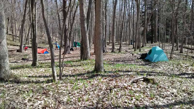 setting up our backpacking camp by the white river