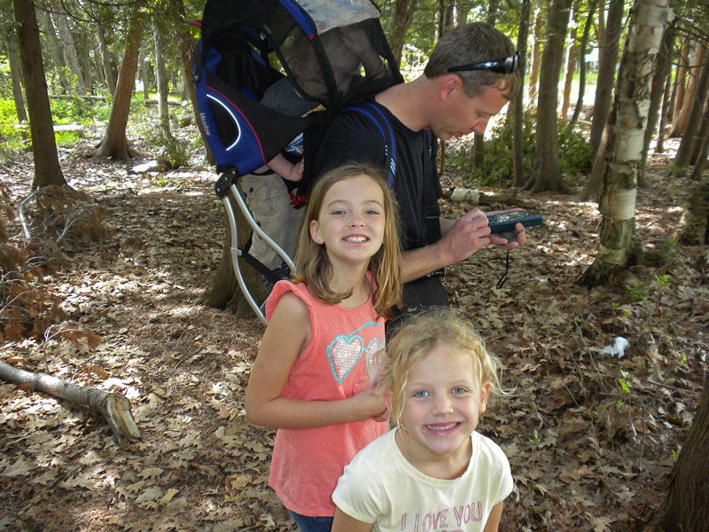 finding a geocache on the way back from the hike