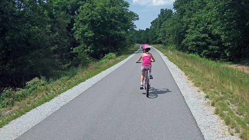 biking down the fred meijer berry junction trail