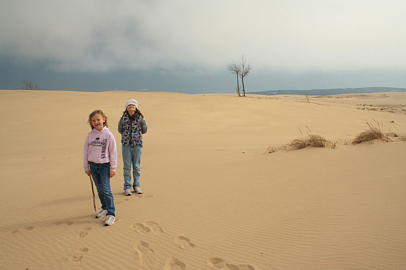 the girls walking through the dunes at silver lake